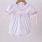 White cross smocked ruffle bubble