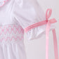 White cross smocked ruffle bubble