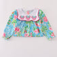Green floral character applique dress