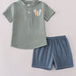 Green character applique shorts set