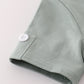 Green character applique shorts set