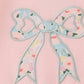 Pink floral print bow applique ruffle romper