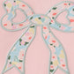 Pink floral print bow applique ruffle romper