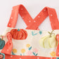 Platinum pumpkin print ruffle apron dress