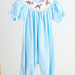 Blue puppy hand smocked girl romper