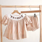Khaki he is risen hand-smocked girl bloomer set
