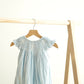 Blue easter cross hand-smocked girl bubble