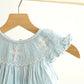 Blue easter cross hand-smocked girl bubble