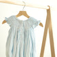 Blue easter cross hand-smocked girl bubble