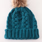 Teal pompom cable beanie