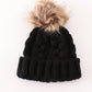 Black pompom cable beanie