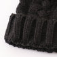 Black pompom cable beanie