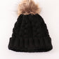 Black pompom cable beanie