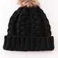 Black pompom cable beanie