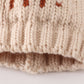 Beige pompom hi cable beanie