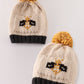 Beige pompom bee cable beanie