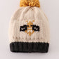 Beige pompom bee cable beanie