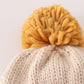 Beige pompom bee cable beanie