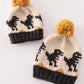 Black pompom dinosaur cable beanie