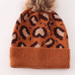 Brown pompom leopard cable beanie