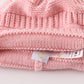 Pink pompom cable beanie