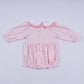 Pink gingerbread hand smocked gingham ruffle bubble