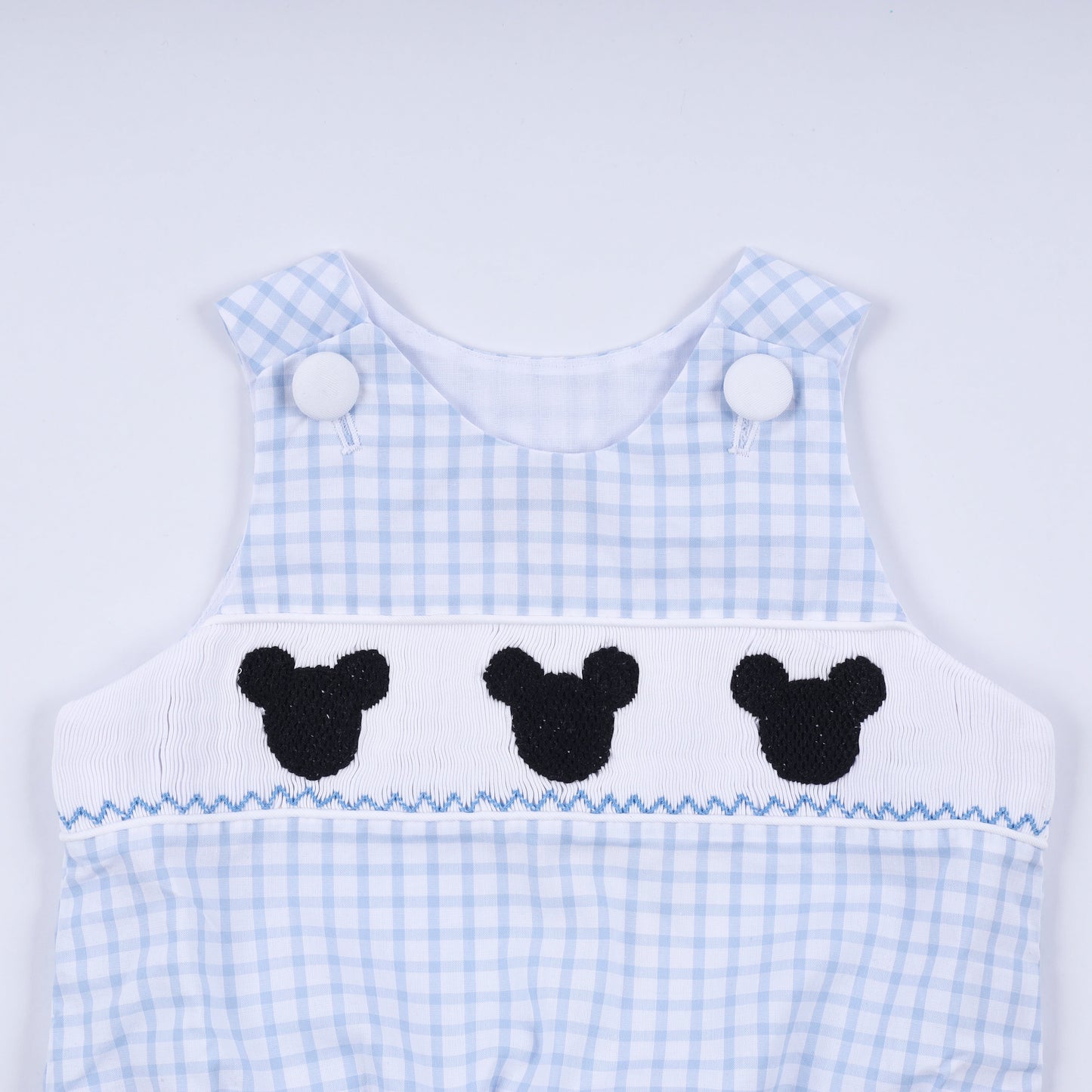 Blue character hand smocked gingham bubble