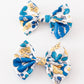 Blue floral print piggie hair bow