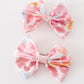 Pink character print piggie hair bow