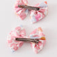 Pink character print piggie hair bow