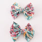 Teal floral print piggie hair bow