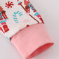 Pink christmas nutcracker print ruffle romper