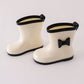 White & black bow rain boots