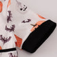 Black pumpkin print romper