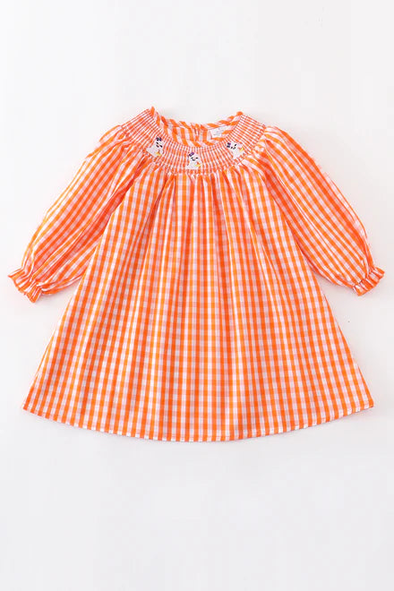 Orange smocked ghost dress